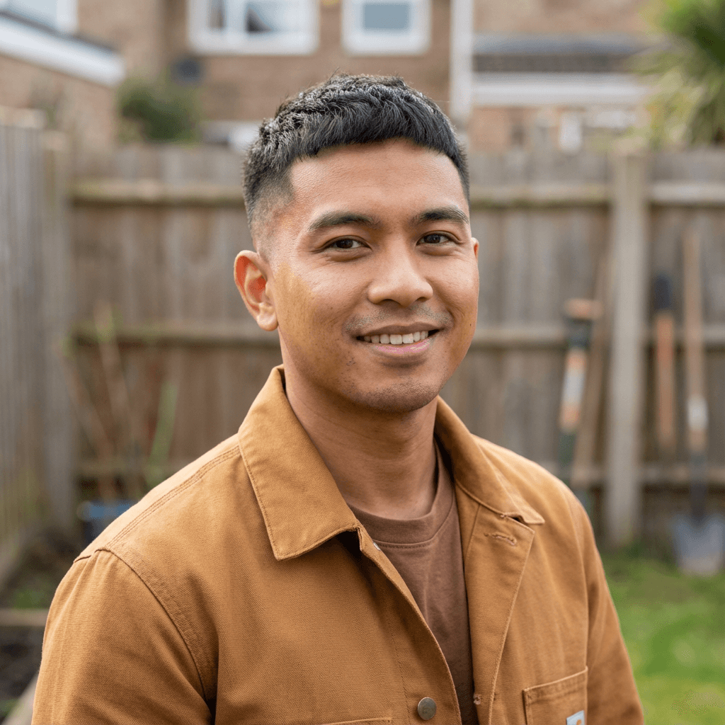 Man in casual work clothes, steady gaze